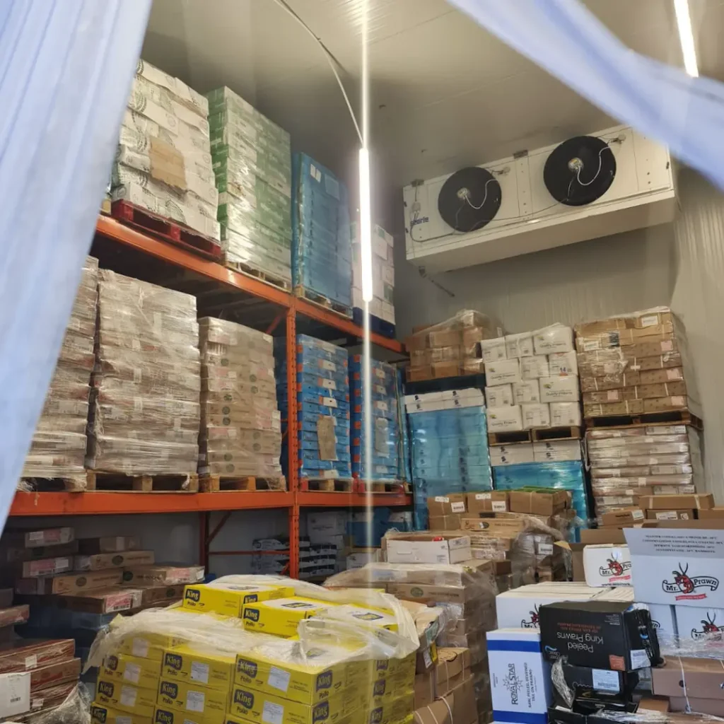 Commercial Fridge With Reacking Containing Pallets Of Food